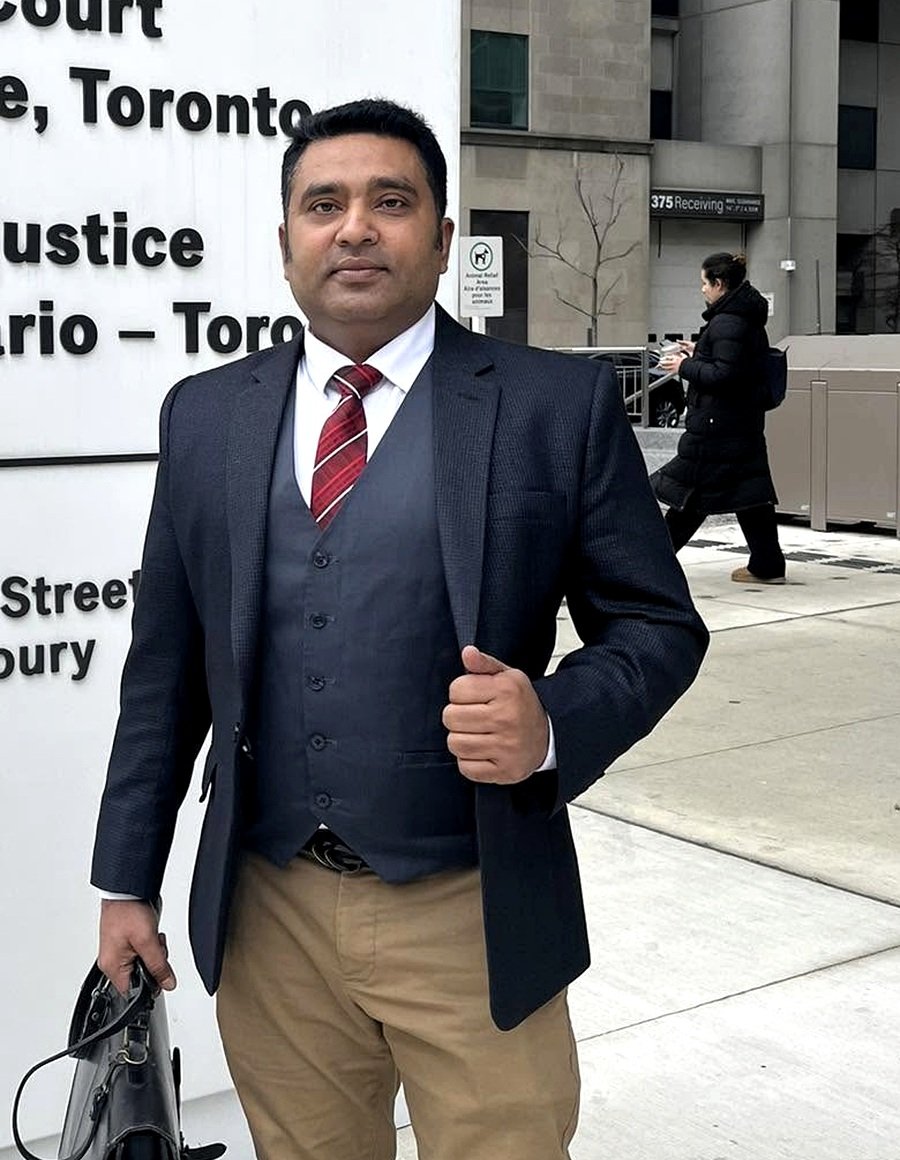 Santonur Rashed Santo in professional attire outside the Ontario Court of Justice